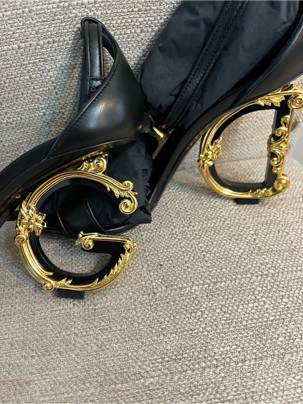 Dolce & Gabbana Black Leather Sandals with Ornate Gold Scroll Heels